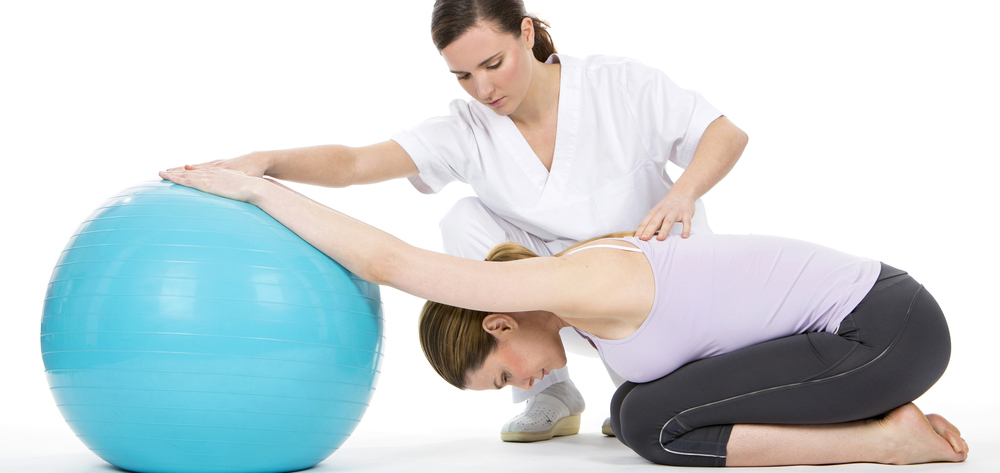 New mother with physical therapist